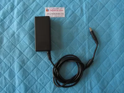 Dell orjinal adaptör la65ns2-01 19.5volt 3.34amper kalin iğne uç (2 yerinde bez bant var tamir onarim yok)